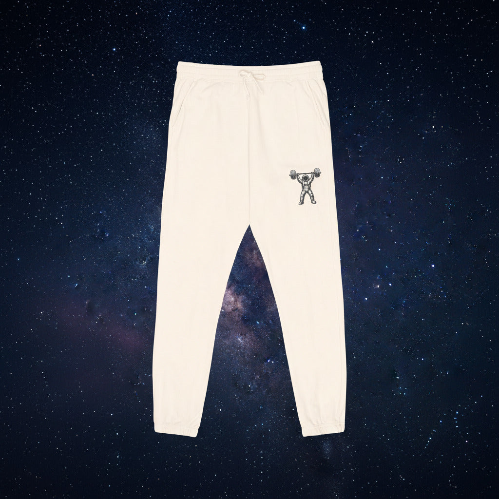 Beige sweatpants with a small graphic on a white background