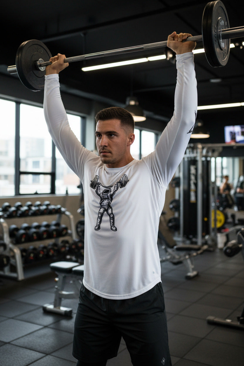 White long-sleeve shirt with an astronaut lifting weights graphic on a white background